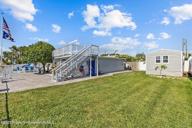 4387 6th Isle Dr, Hernando Beach, FL 34607 - rear view of house with stairway, a patio area, and a deck