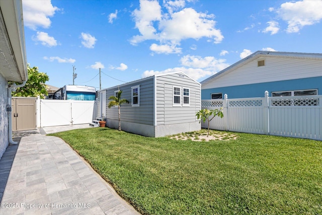 4387 6th Isle Dr, Hernando Beach, FL 34607 - view of yard with a gate and an outbuilding