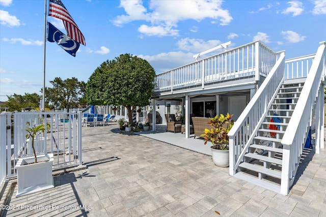 4387 6th Isle Dr, Hernando Beach, FL 34607 - view of patio / terrace featuring stairs, a deck, and a gate