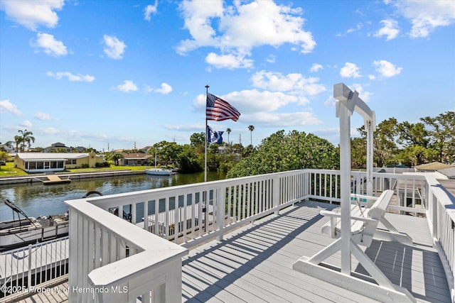 4387 6th Isle Dr, Hernando Beach, FL 34607 - wooden terrace featuring a water view