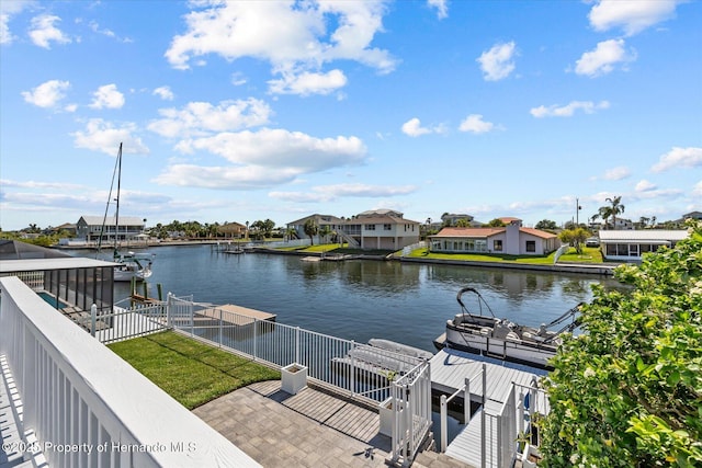 4387 6th Isle Dr, Hernando Beach, FL 34607 - dock area with a water view, a residential view, and boat lift