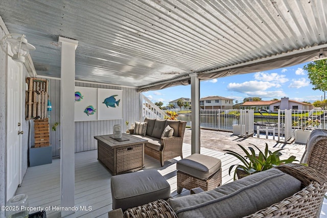 4387 6th Isle Dr, Hernando Beach, FL 34607 - wooden deck featuring a water view, outdoor lounge area, and a residential view