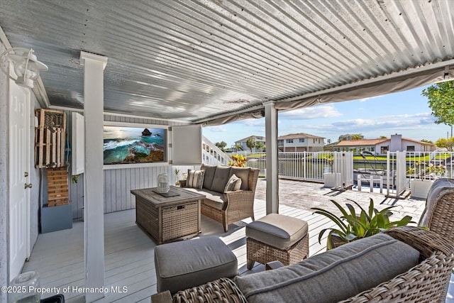 4387 6th Isle Dr, Hernando Beach, FL 34607 - wooden deck featuring an outdoor living space, a water view, and a residential view