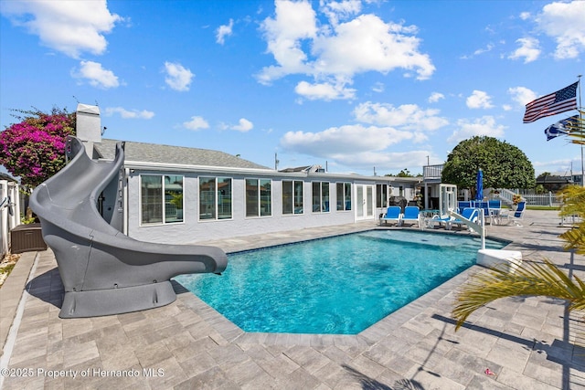 4387 6th Isle Dr, Hernando Beach, FL 34607 - view of swimming pool featuring a water slide and a patio area