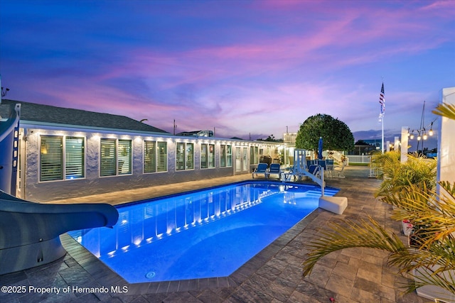 4387 6th Isle Dr, Hernando Beach, FL 34607 - swimming pool with a water slide and a patio