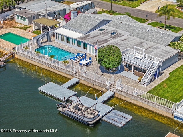 4387 6th Isle Dr, Hernando Beach, FL 34607 - drone / aerial view of a pool and a large body of water