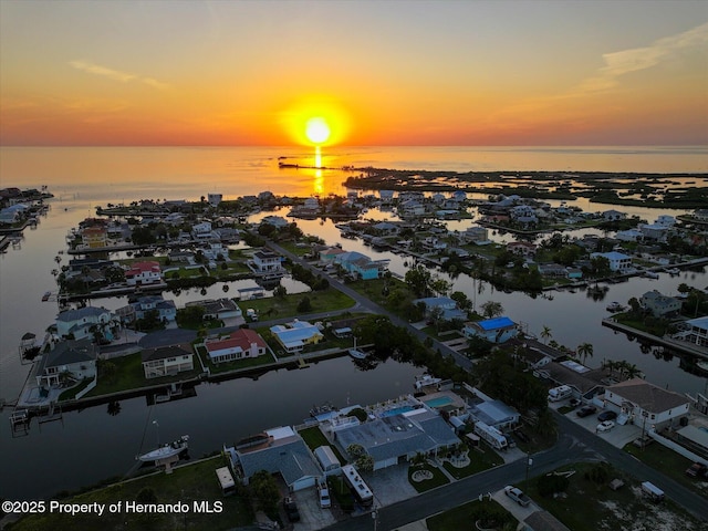 4387 6th Isle Dr, Hernando Beach, FL 34607 - aerial perspective of suburban area with a nearby body of water