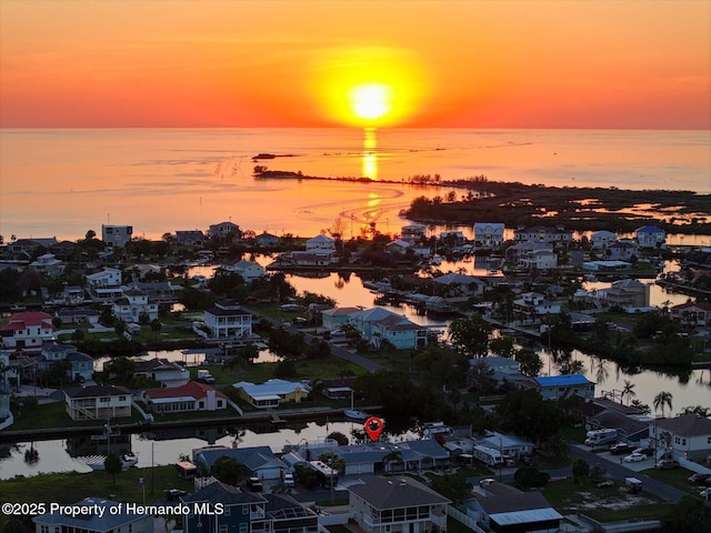 4387 6th Isle Dr, Hernando Beach, FL 34607 - aerial perspective of suburban area featuring a large body of water