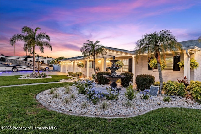 4387 6th Isle Dr, Hernando Beach, FL 34607 - single story home with a lawn, a garage, and driveway