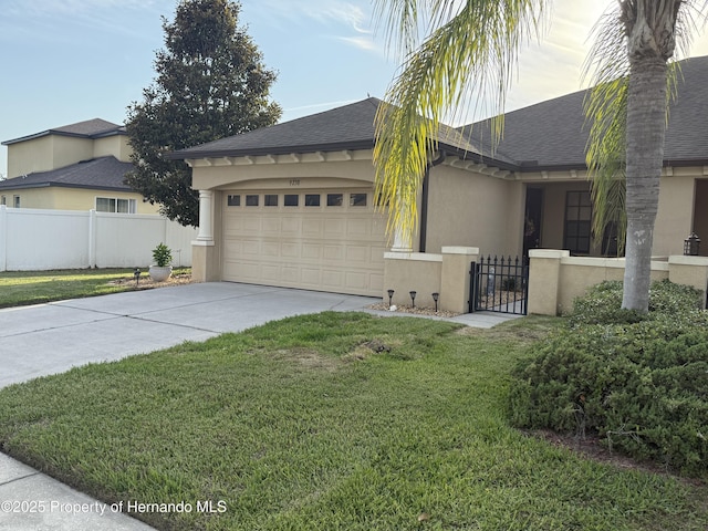 9238 Southern Charm Cir, Brooksville, FL 34613 - view of property exterior with stucco siding, concrete driveway, a shingled roof, a garage, and a gate