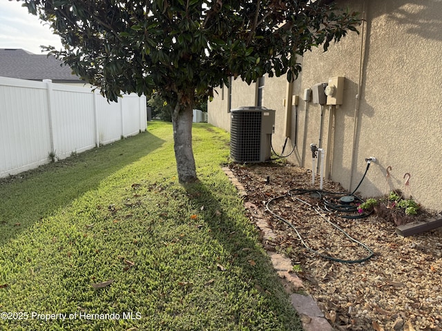 9238 Southern Charm Cir, Brooksville, FL 34613 - view of yard featuring central air condition unit