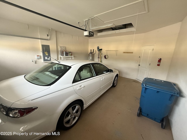 9238 Southern Charm Cir, Brooksville, FL 34613 - garage with electric panel and a garage door opener
