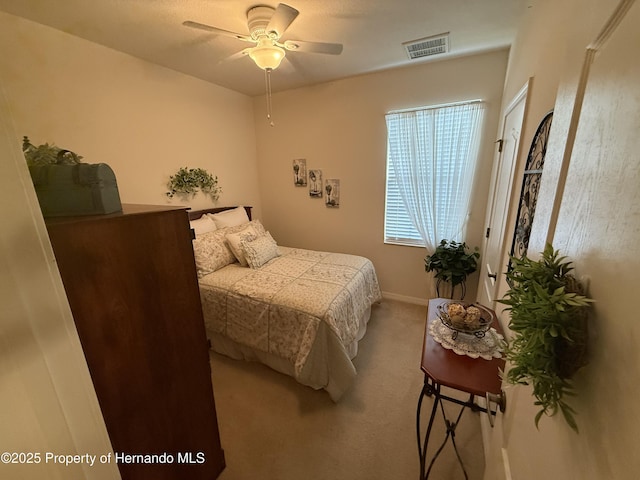 9238 Southern Charm Cir, Brooksville, FL 34613 - bedroom featuring light carpet and ceiling fan