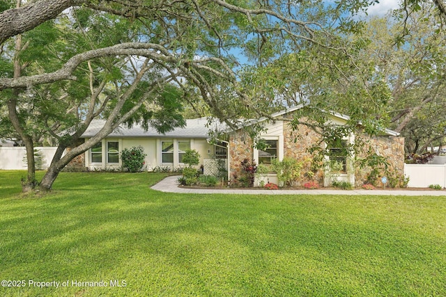 18633 Oak Way Dr, Hudson, FL 34667 - view of front of house featuring stone siding and stucco siding