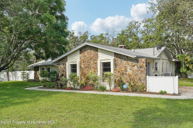 18633 Oak Way Dr, Hudson, FL 34667 - mid-century modern home with stone siding