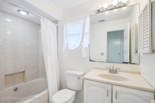 18633 Oak Way Dr, Hudson, FL 34667 - full bathroom with vanity, toilet, and shower / bathtub combination with curtain