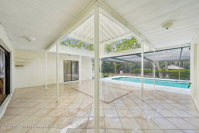 18633 Oak Way Dr, Hudson, FL 34667 - swimming pool featuring a patio and glass enclosure