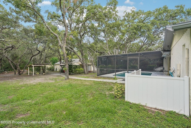 18633 Oak Way Dr, Hudson, FL 34667 - view of grassy yard featuring an outdoor pool and a lanai