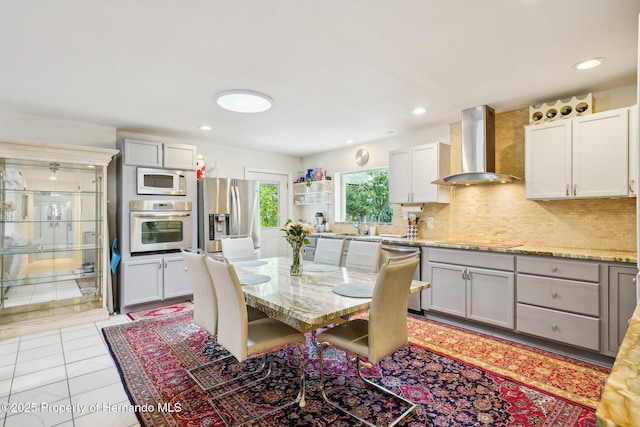 18633 Oak Way Dr, Hudson, FL 34667 - dining area featuring light tile patterned floors and recessed lighting
