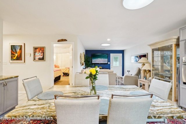 18633 Oak Way Dr, Hudson, FL 34667 - dining space with light tile patterned floors and recessed lighting
