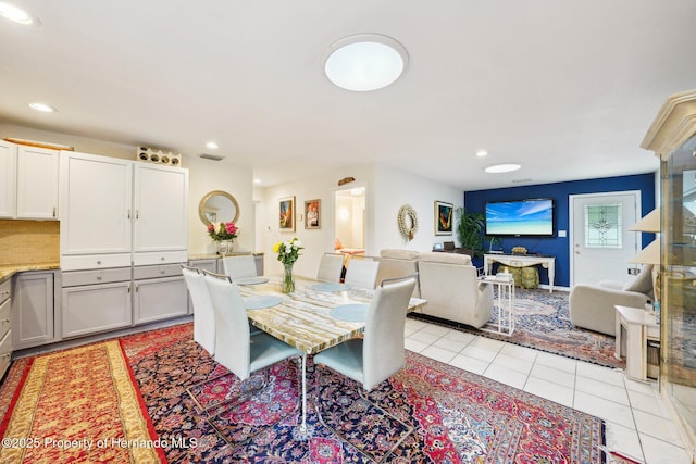 18633 Oak Way Dr, Hudson, FL 34667 - dining area with light tile patterned floors and recessed lighting