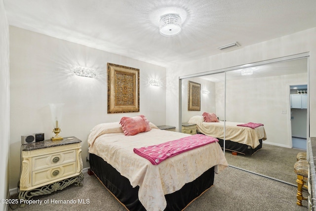 18633 Oak Way Dr, Hudson, FL 34667 - bedroom featuring dark carpet, a closet, and baseboards