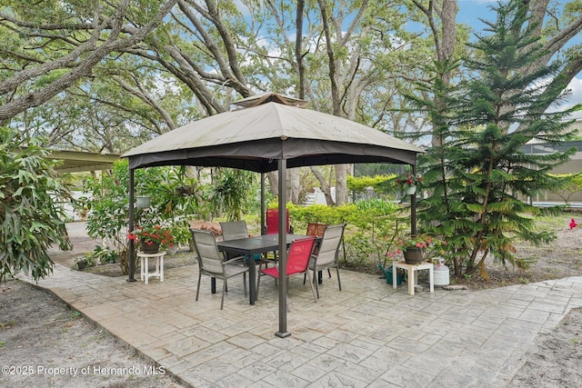 18633 Oak Way Dr, Hudson, FL 34667 - view of patio / terrace featuring a gazebo and outdoor dining area