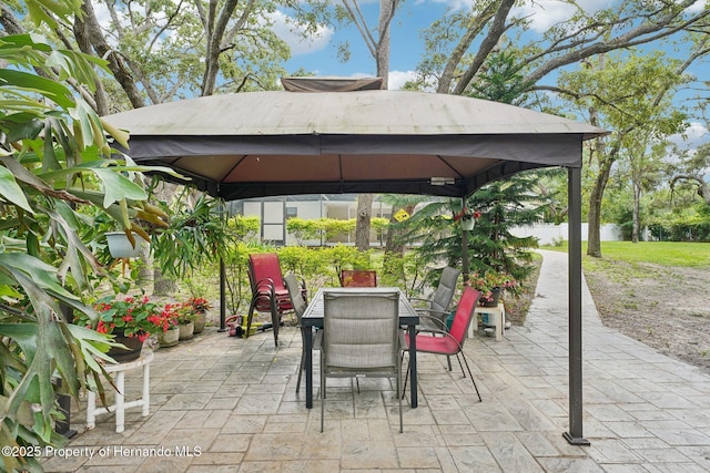 18633 Oak Way Dr, Hudson, FL 34667 - view of patio / terrace with a gazebo and outdoor dining area