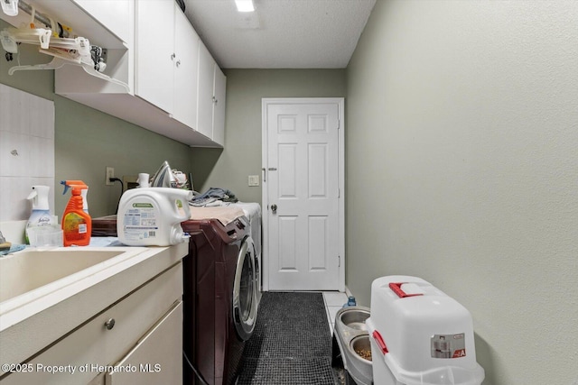 10267 Elgin Blvd, Spring Hill, FL 34608 - washroom featuring washer and dryer, cabinet space, and tile patterned floors