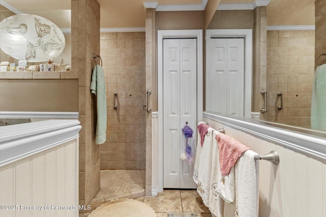 10267 Elgin Blvd, Spring Hill, FL 34608 - bathroom with walk in shower, ornamental molding, a closet, and tile patterned flooring
