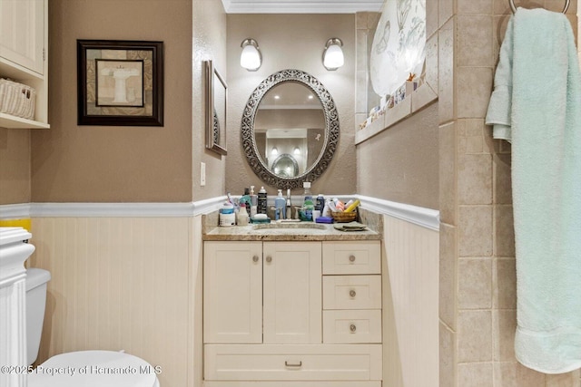10267 Elgin Blvd, Spring Hill, FL 34608 - bathroom featuring wainscoting, toilet, and vanity