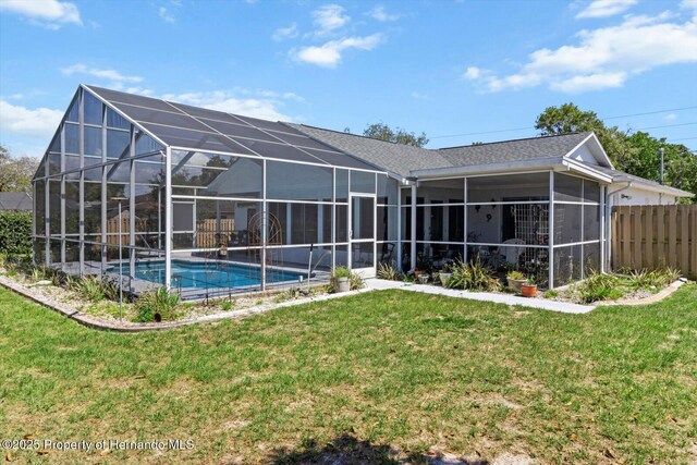 10267 Elgin Blvd, Spring Hill, FL 34608 - rear view of house with an outdoor pool and glass enclosure