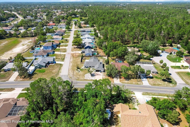10267 Elgin Blvd, Spring Hill, FL 34608 - aerial view of property and surrounding area featuring nearby suburban area and a forest