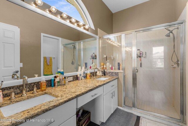 9407 Burnam Dr, Weeki Wachee, FL 34613 - full bathroom featuring double vanity and a shower stall