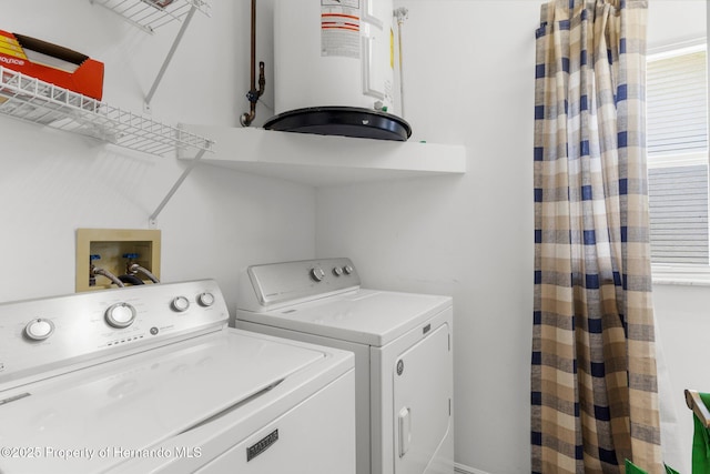 9407 Burnam Dr, Weeki Wachee, FL 34613 - laundry area featuring washer and clothes dryer and water heater