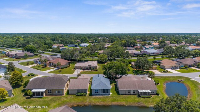 9407 Burnam Dr, Weeki Wachee, FL 34613 - aerial perspective of suburban area featuring a large body of water