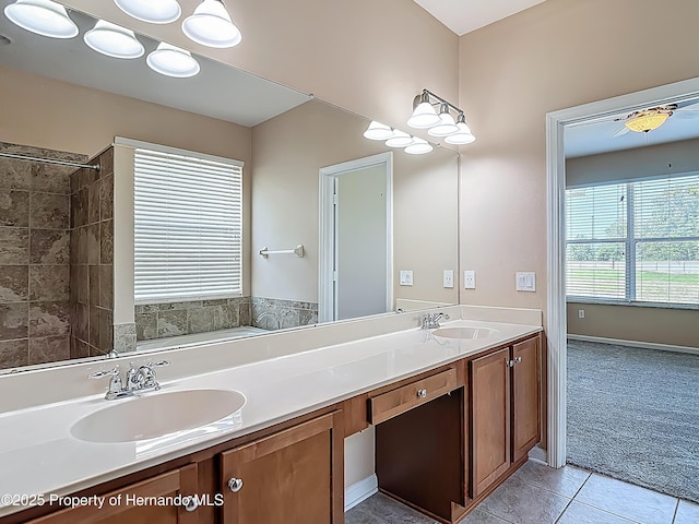 14137 Wake Robin Dr, Brooksville, FL 34604 - bathroom featuring double vanity, tile patterned floors, and tiled shower