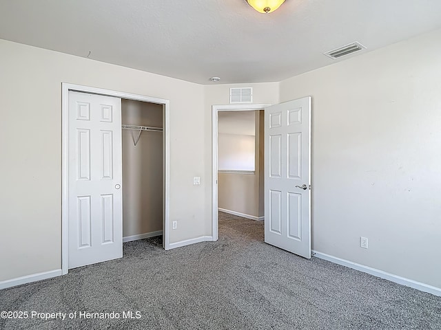 14137 Wake Robin Dr, Brooksville, FL 34604 - unfurnished bedroom featuring carpet, baseboards, and a closet