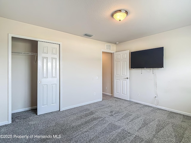 14137 Wake Robin Dr, Brooksville, FL 34604 - unfurnished bedroom featuring carpet flooring, baseboards, and a closet