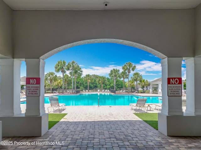 14137 Wake Robin Dr, Brooksville, FL 34604 - community pool featuring a patio