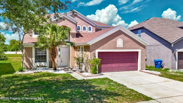 14137 Wake Robin Dr, Brooksville, FL 34604 - view of front facade with stucco siding, an attached garage, a front lawn, and concrete driveway