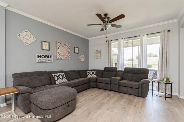 224 W Rexford Dr, Beverly Hills, FL 34465 - living area with ornamental molding, ceiling fan, light wood finished floors, and baseboards