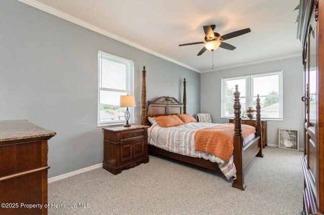 224 W Rexford Dr, Beverly Hills, FL 34465 - bedroom with light colored carpet, baseboards, ornamental molding, and a ceiling fan
