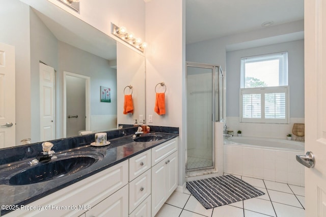 224 W Rexford Dr, Beverly Hills, FL 34465 - full bathroom with a stall shower, double vanity, a garden tub, and tile patterned floors