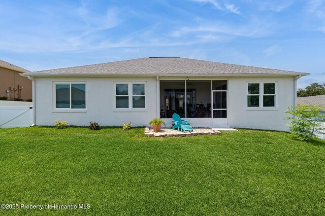 224 W Rexford Dr, Beverly Hills, FL 34465 - rear view of property featuring a sunroom and stucco siding