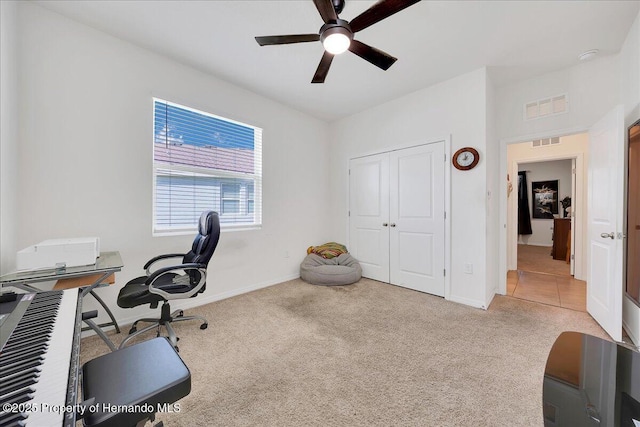 13454 Golden Lime Ave, Spring Hill, FL 34609 - carpeted home office featuring a ceiling fan and baseboards