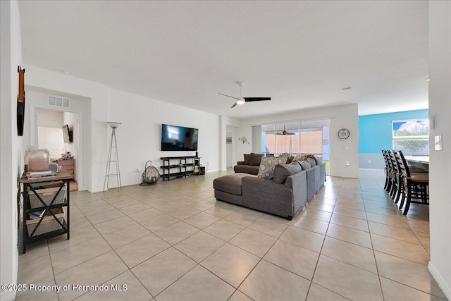 13454 Golden Lime Ave, Spring Hill, FL 34609 - living room featuring light tile patterned flooring and a ceiling fan