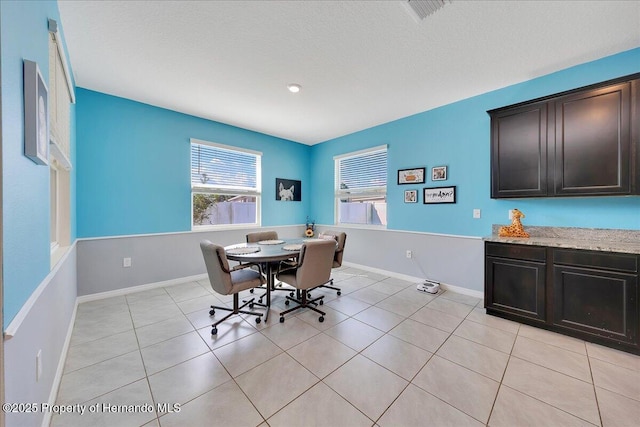 13454 Golden Lime Ave, Spring Hill, FL 34609 - dining space featuring light tile patterned flooring and baseboards