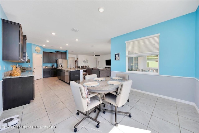 13454 Golden Lime Ave, Spring Hill, FL 34609 - dining area with recessed lighting, light tile patterned floors, and baseboards