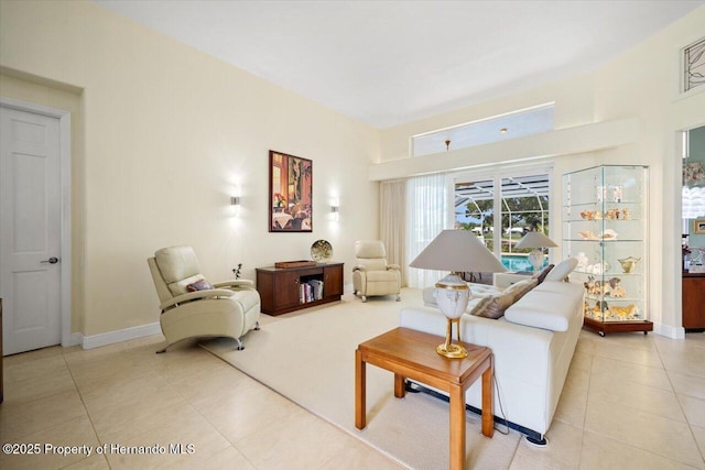 9161 Southern Comfort Ct, Weeki Wachee, FL 34613 - living area with baseboards and light tile patterned floors
